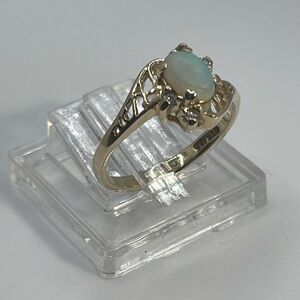14K Solid Gold Vintage Natural Opal Ring with Diamond Accents.
Market GRP
3 1/2